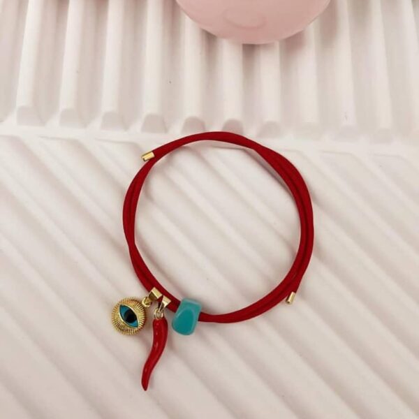 Pulsera imantada con ojo de Santa Lucía, Cornisello rojo y piedra natural de murano